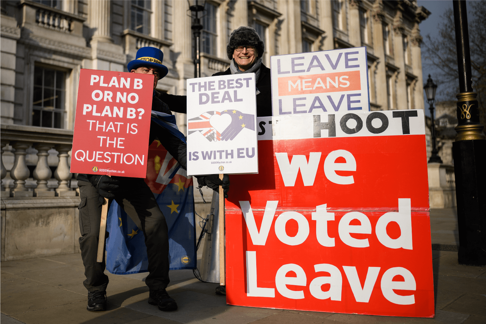 Photograph of Brexit supporters and protesters holding signs