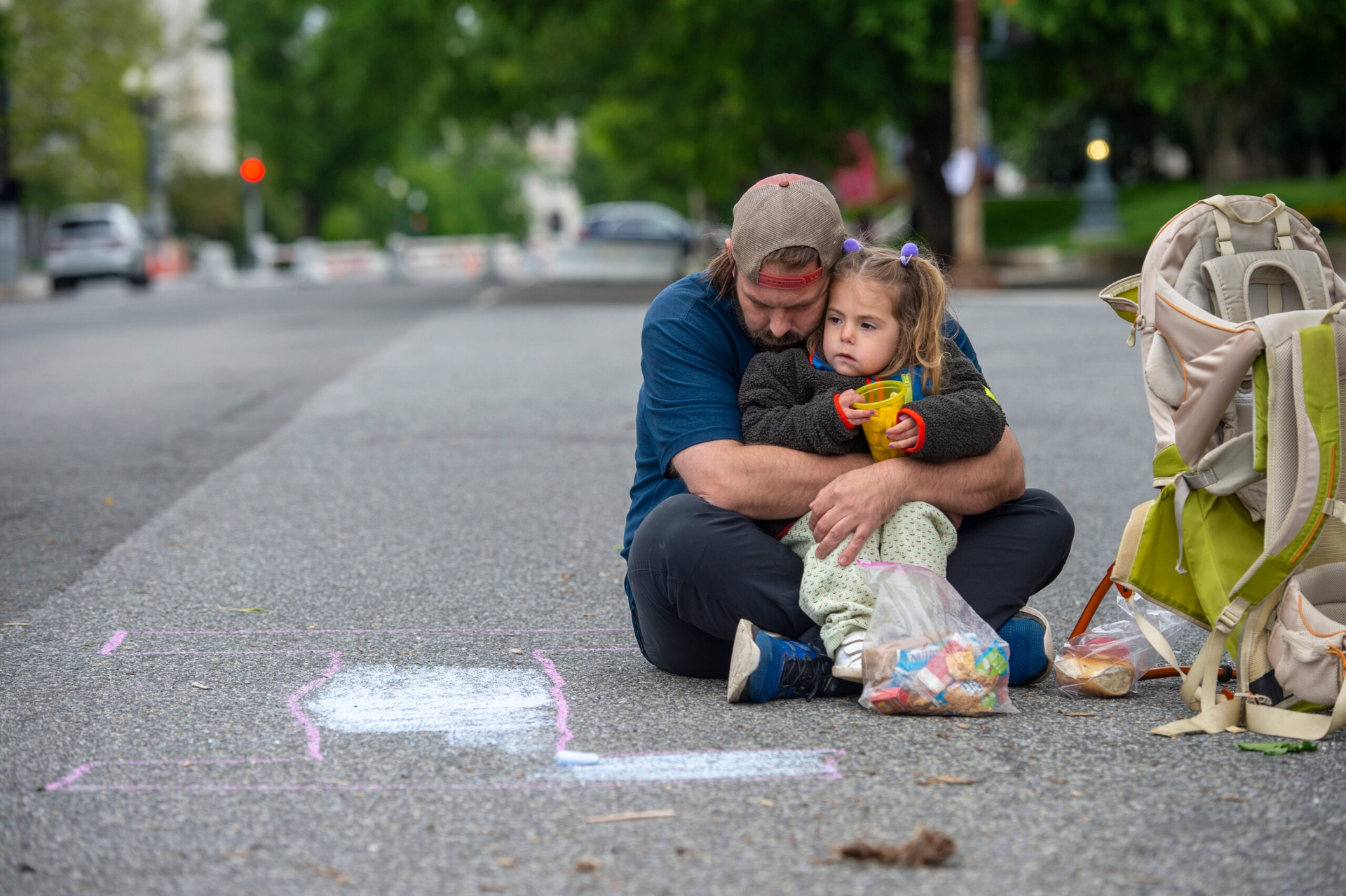 Image of parent with a child during an abortion rights demonstration